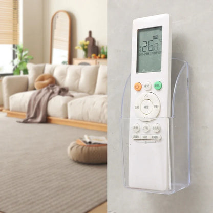 Wall mounted transparent remote holder.