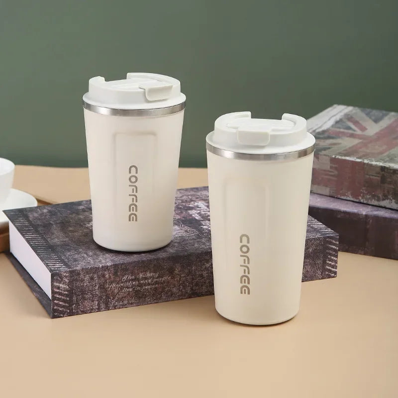 Insulated mug for keeping drinks hot or cold on the go.